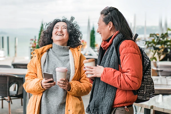 two people chatting over coffee